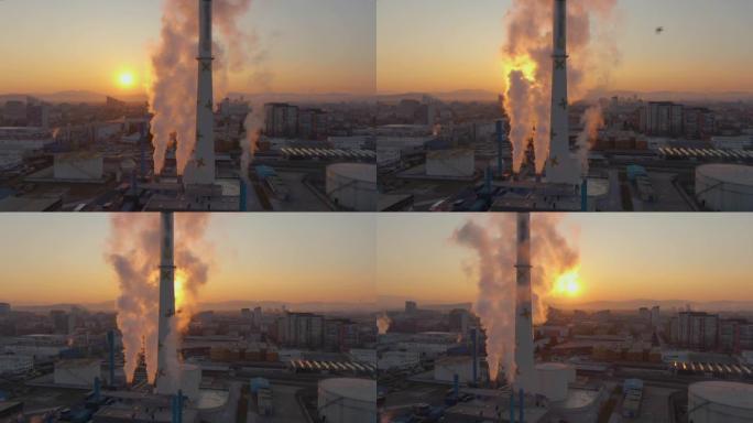 空中: 日落时，卢布尔雅那电站烟囱升起白烟。