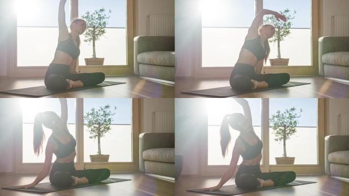 身体意识强的女人保持健康，在客厅在家做瑜伽