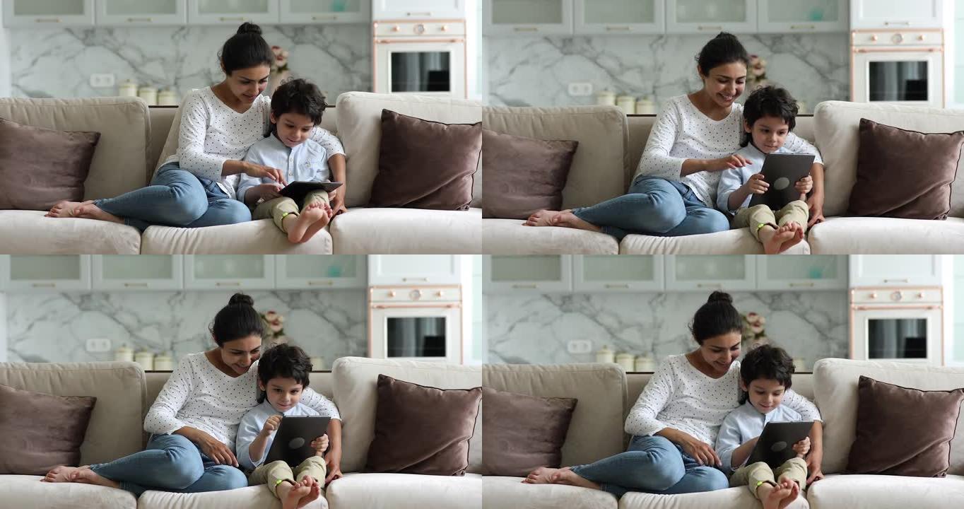 印度家庭妈妈和男孩在pad上使用交互式应用程序