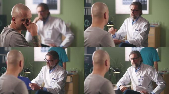 秃头男子对乐队新闻做出反应，并与肿瘤学家交谈