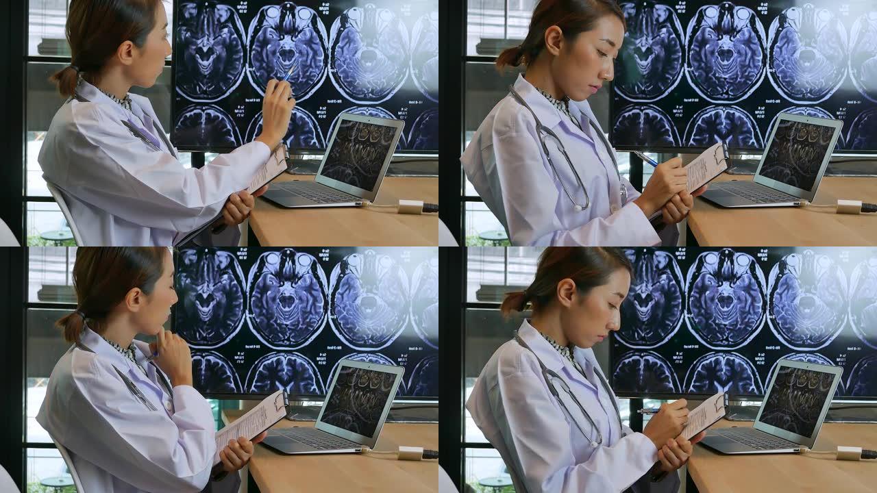 使用数字平板电脑的年轻亚洲医生