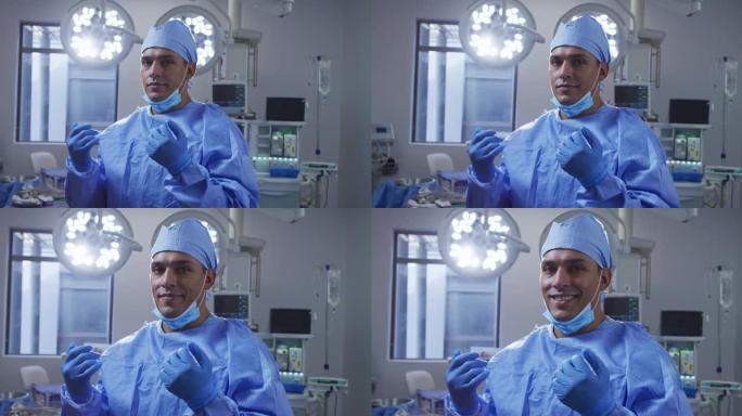 混合种族男外科医生在手术室里戴着低面罩微笑的肖像