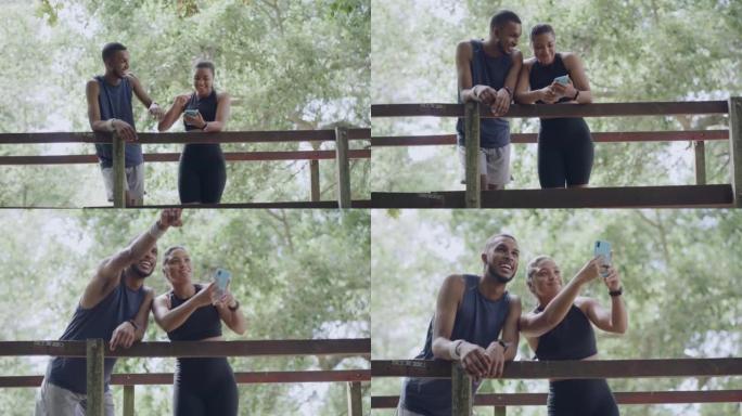 夏季，两名健康的运动员在公园的一座桥上击掌。年轻健康的夫妇在外面一起训练时拍照。专注的夫妇在大自然中