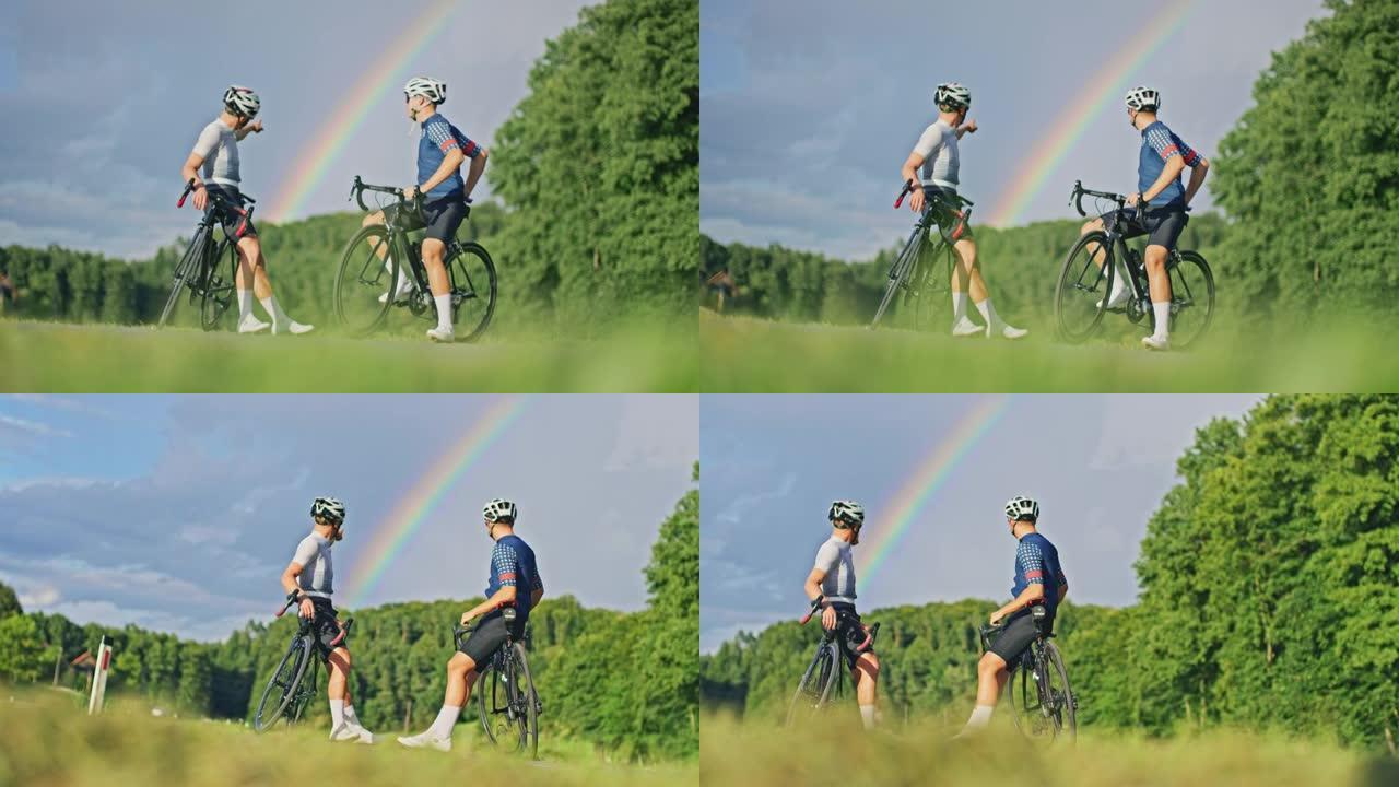 SLO MO两个年轻的骑自行车者看着乡村某个地方的彩虹
