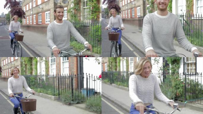 夫妇一起沿着城市街道骑自行车