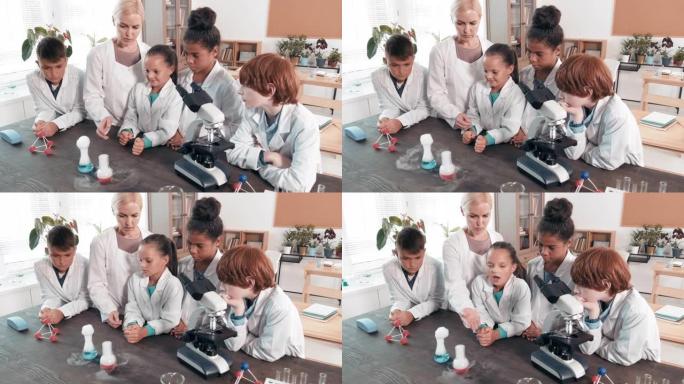 女科学老师向孩子们展示实验