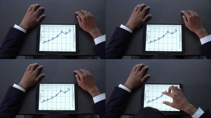 数字平板电脑中的商人手工检查统计分析