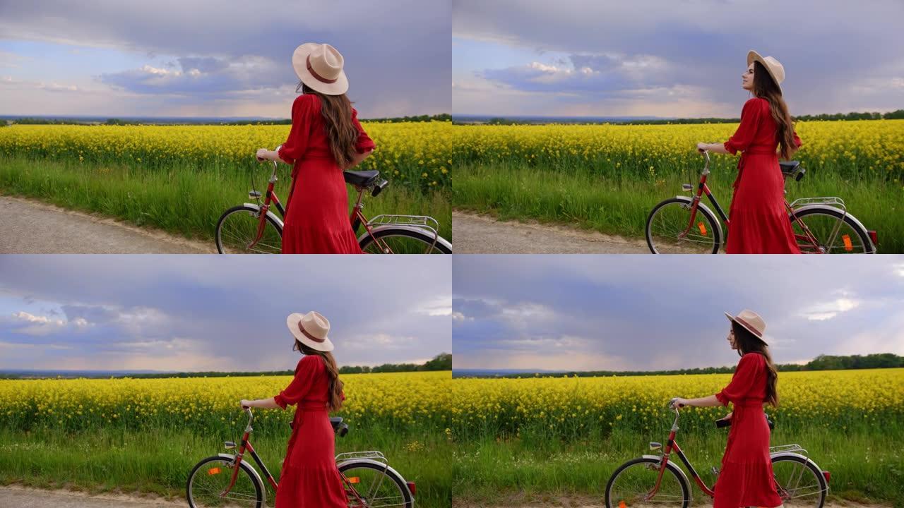 中，跟踪拍摄了一个穿着红色连衣裙的黑发女人，她骑着自行车被snapdragon花朵包围着，慢动作