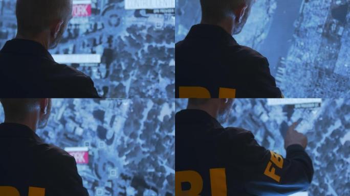 身穿制服的联邦调查局特工在一个大的HUD屏幕上工作，我们看到他从腰部以上的背部