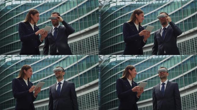 微笑的女商人通过在摩天大楼背景上使用vr眼镜向合作伙伴或同事展示新项目的电影镜头。技术、财务、交易、