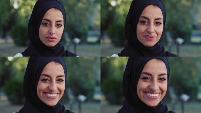 美丽的年轻阿拉伯女子微笑着绿色背景的肖像。带着头巾的快乐穆斯林女性运动员在清晨锻炼时在公园享受新鲜空