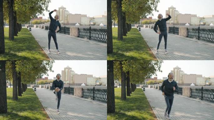 成熟男子在户外训练热身然后在城市街道慢跑的肖像