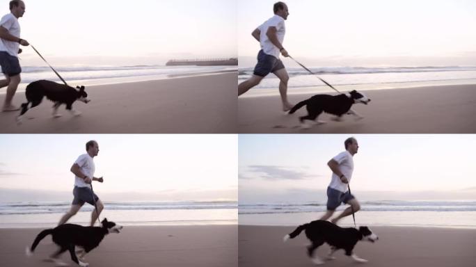 4k视频片段，一名男子在日落时与狗一起在海滩上奔跑