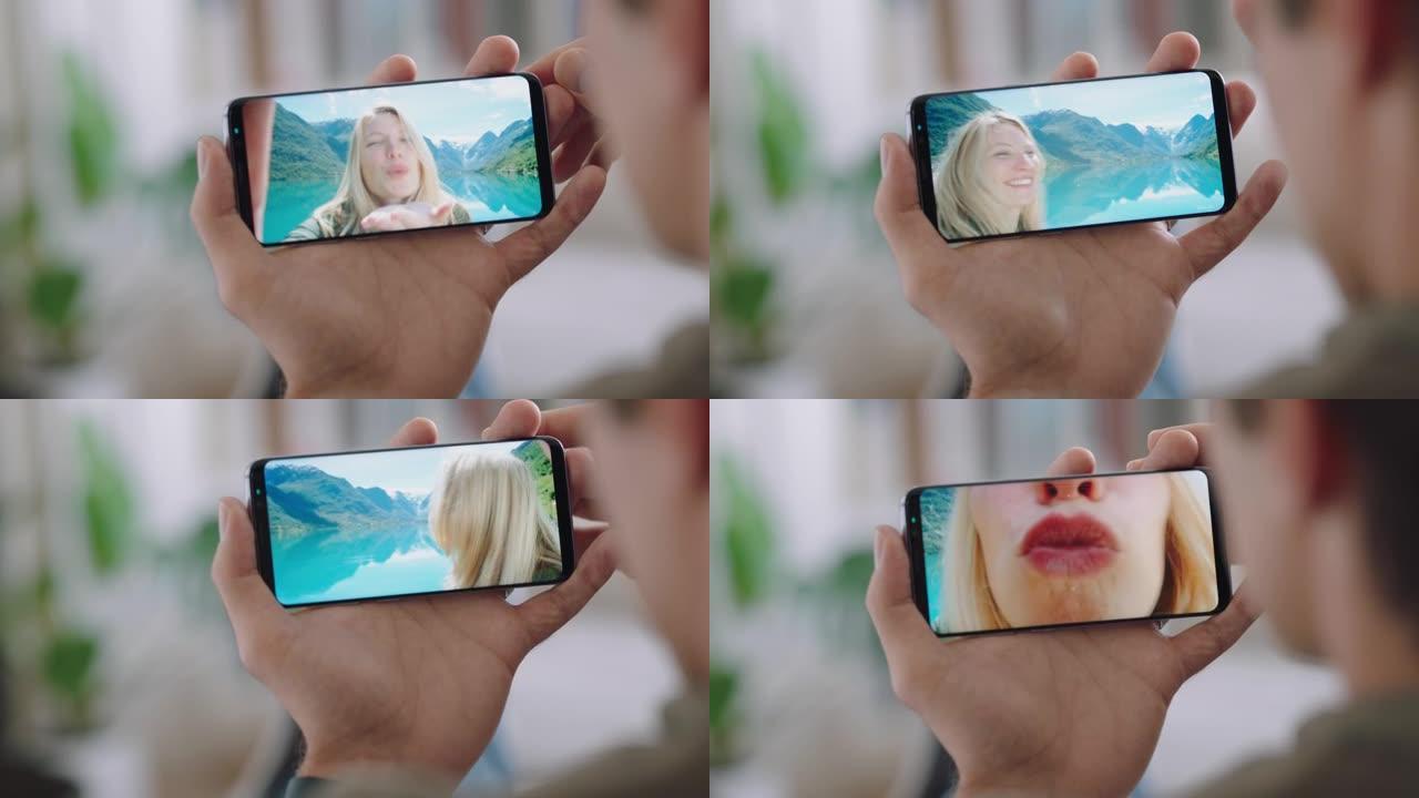 年轻人在挪威度假时使用智能手机与女友视频聊天，分享旅行经历，享受假期冒险的乐趣，用手机交流4k镜头