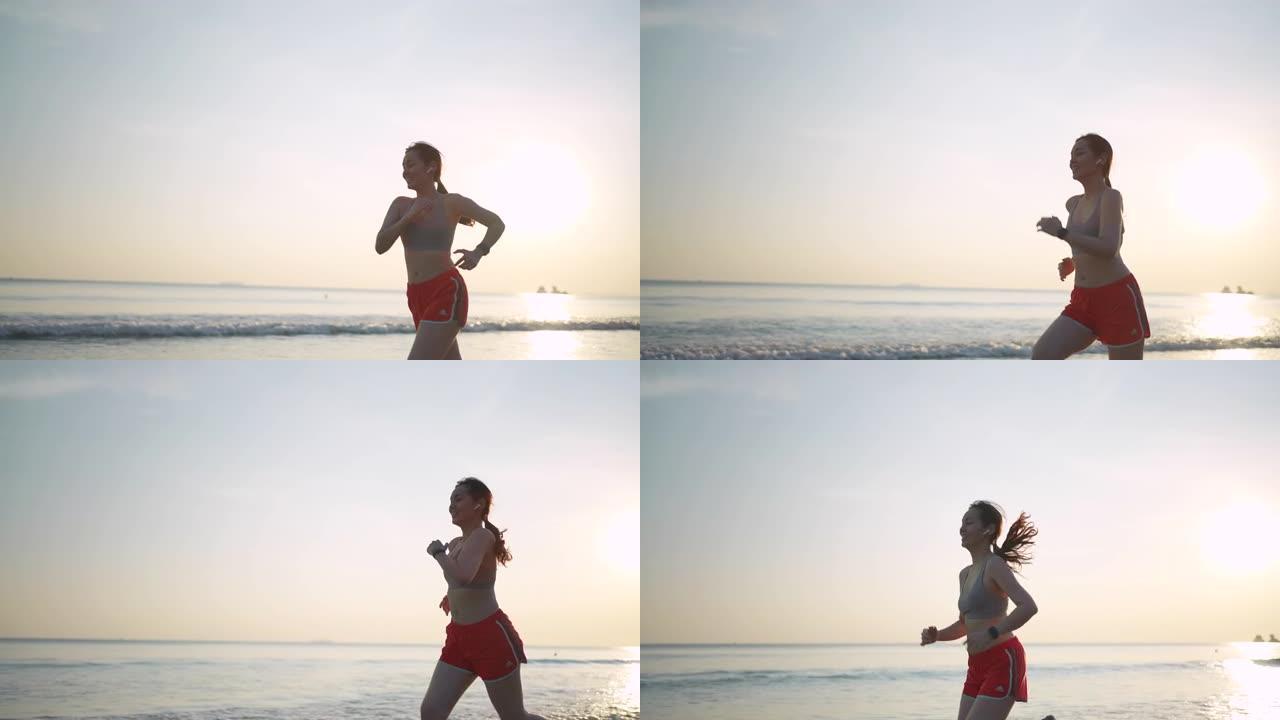 日落时在沙滩上奔跑的亚洲女子慢动作