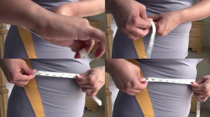 测量腰部超重女性的特写