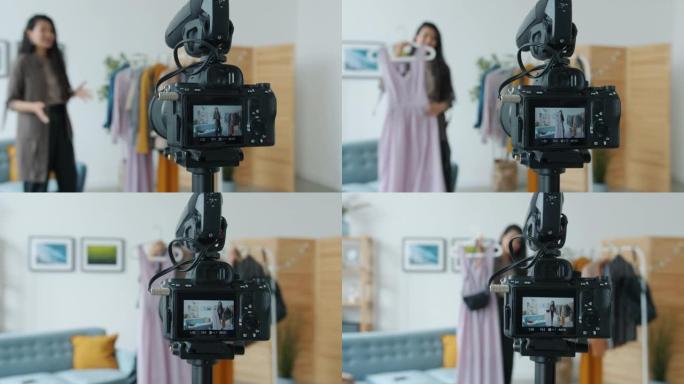数码相机屏幕特写显示女性造型师录制时尚服装视频