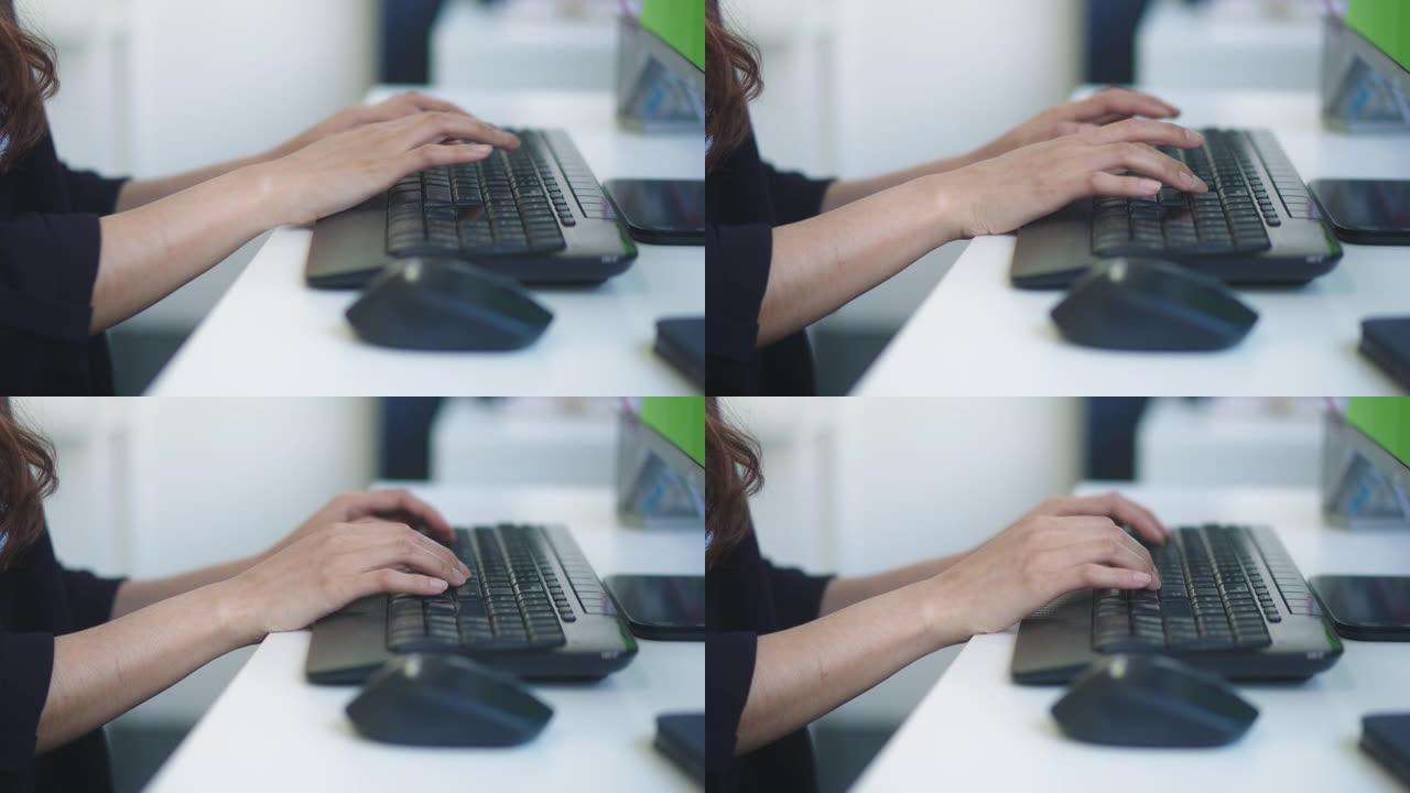 色度键: 有吸引力的成功的女商人在她的办公室里用笔记本电脑工作，有城市景观的视窗。强大的独立女性首席