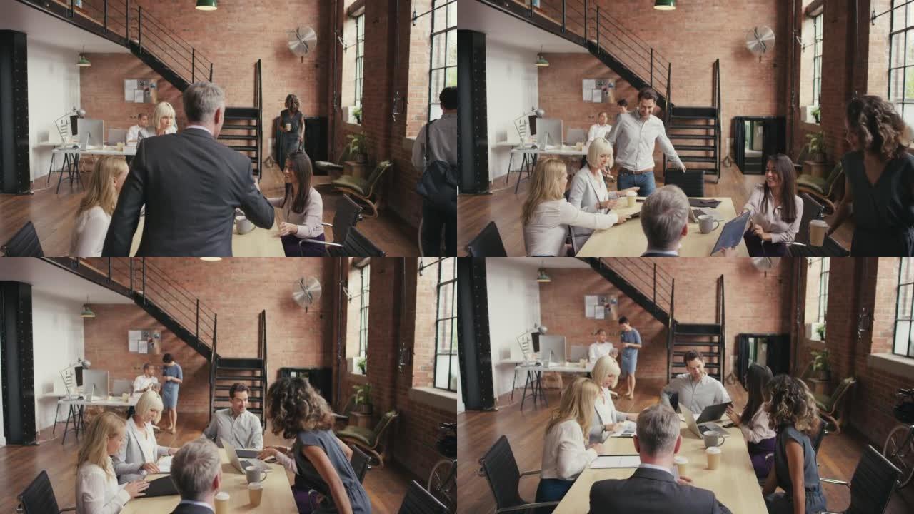 一群在现代办公室开会的商人的4k录像