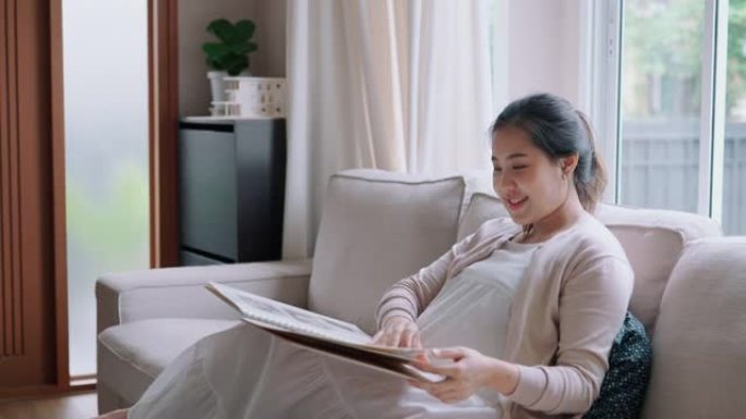 孕妇看着笔记本。