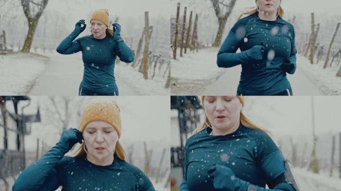 SLO MO女人在开始在雪地里慢跑之前，将入耳式耳机放在耳朵里