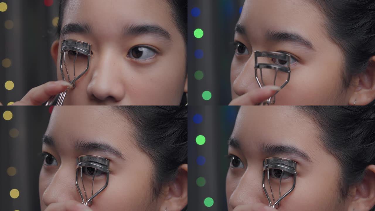 年轻的亚洲有影响力的女孩vloging演示如何用美容化妆品化妆。她在家里的客厅里用相机记录在线辅导班