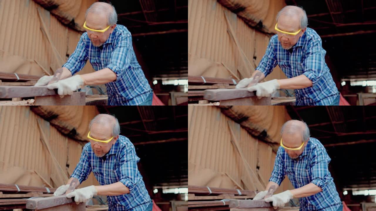 木匠用砂纸工作。