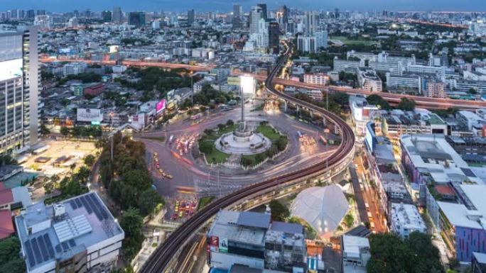 曼谷白天到晚上都有胜利纪念碑和交通道路的城市景观的时间流逝