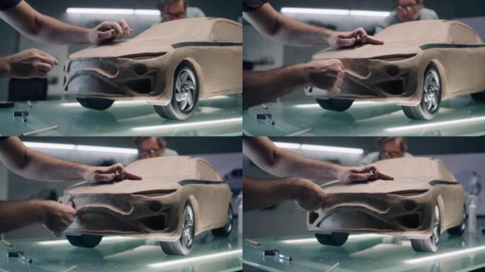 男性设计师创造橡皮泥汽车模型