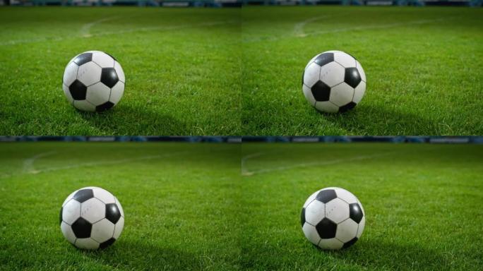 一个足球的特写镜头。概念镜头代表游戏的开始，成功，胜利，运动和生活的决心。电影低角度地面艺术Arct