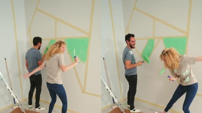 顽皮的年轻夫妇喜欢在家粉刷墙壁。