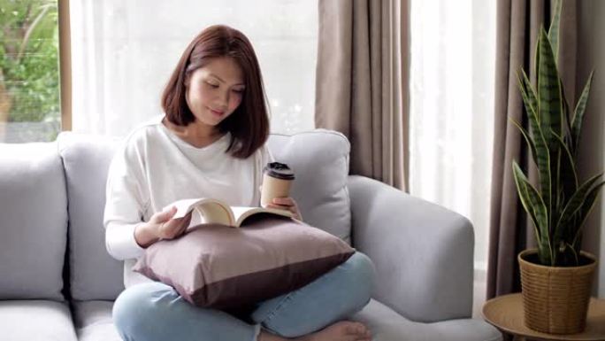 女人在家里放松时间看书喝咖啡