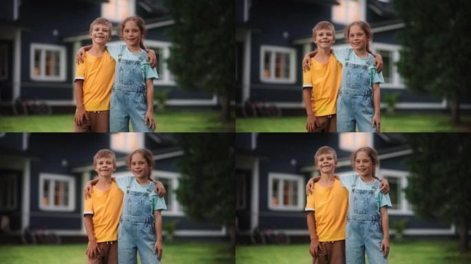 年轻快乐的哥哥和姐姐站在乡间别墅前，互相拥抱，看着镜头，微笑着。两个孩子享受童年和友谊。