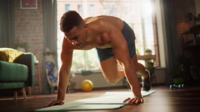 强壮的运动黑人在家庭健身房赤膊锻炼，做登山者锻炼。瘦身肌肉混合种族运动员保持健康，在家训练。汗水和决