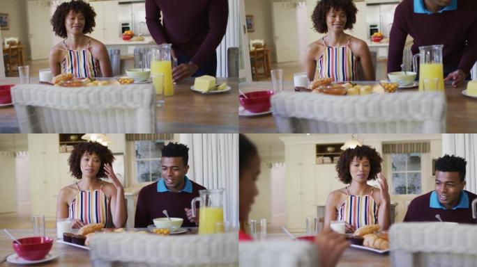 非裔美国人家庭一起坐在家里的餐桌上吃早餐