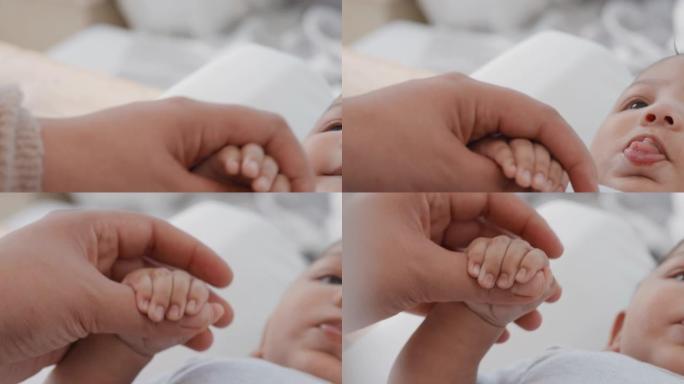 特写妈妈抱着婴儿的手触摸手指妈妈养育新生儿在家照顾婴儿母爱4k