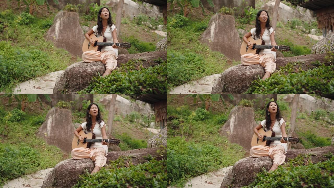 女人在热带自然中弹吉他