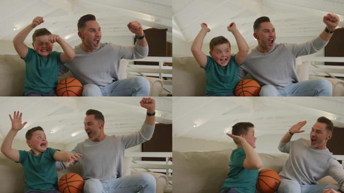 快乐的高加索父亲和儿子在客厅看电视和拿着篮球
