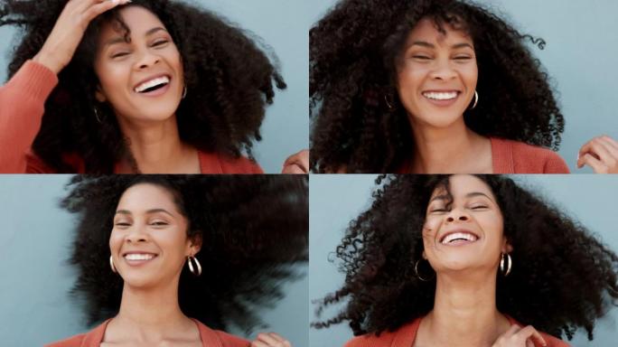 快乐，美丽和自然的头发，黑人妇女微笑着，对着墙大笑，骄傲并拥抱她的卷发。一位非洲裔美国女性的肖像在工