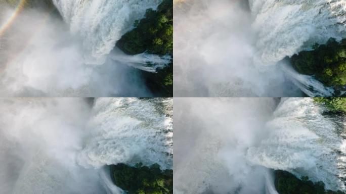 风景秀丽的维多利亚瀑布边缘涌出的水的壮观特写直下鸟瞰图。联合国教科文组织世界遗产