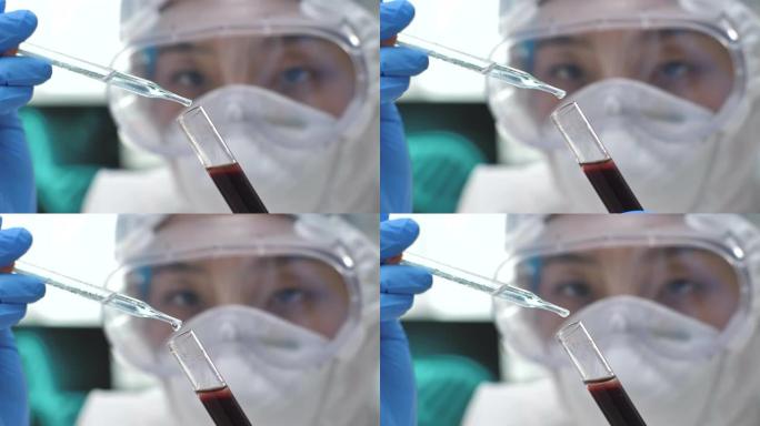 科学家将血样从移液管转移到实验室的显微镜载玻片上，冠状病毒COVID 19测试新型电晕病毒
