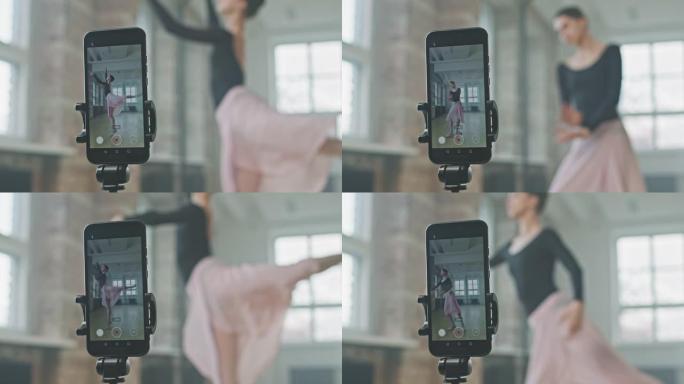 芭蕾舞女演员在智能手机上拍摄自己的舞蹈
