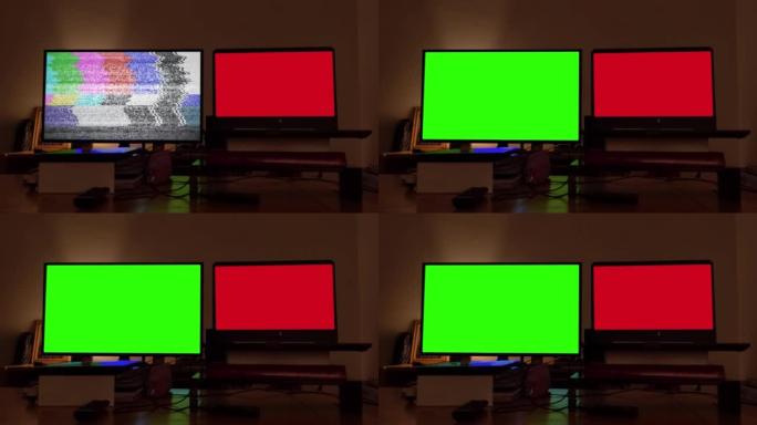 带绿色屏幕的智能电视靠近黑暗房间内带有红色屏幕的笔记本电脑。放大。4k分辨率。