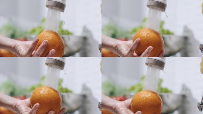 慢动作特写手洗橘子水果