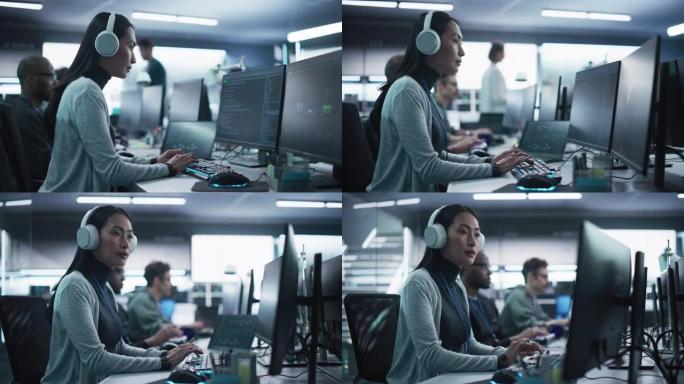 一位有思想的年轻工程师在技术办公环境中从事计算机工作的肖像。美丽的亚洲女人戴着耳机，为区块链项目编写