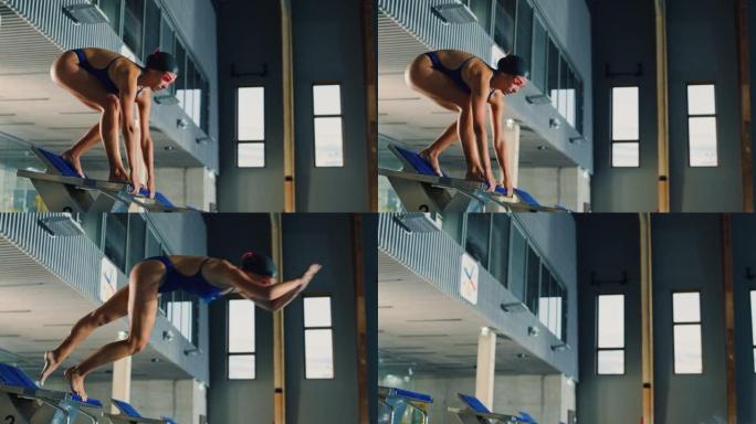 美丽的女游泳者潜入游泳池。职业运动员优雅地跳跃。决心赢得冠军的人训练。电影慢动作，时尚色彩，艺术跟踪