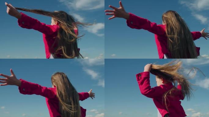 年轻女孩移动长发怀抱天空感受自然自由自在