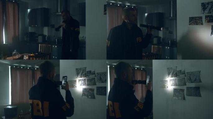 一名身穿制服的联邦调查局探员拿着手电筒检查一间黑暗公寓的厨房，在墙上画着照片。