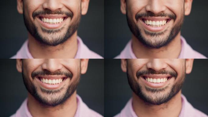 完美的牙齿幸福微笑的人感到高兴和满足。特写自信的大胡子男性的嘴，表达积极的态度和心态。良好的口腔卫生
