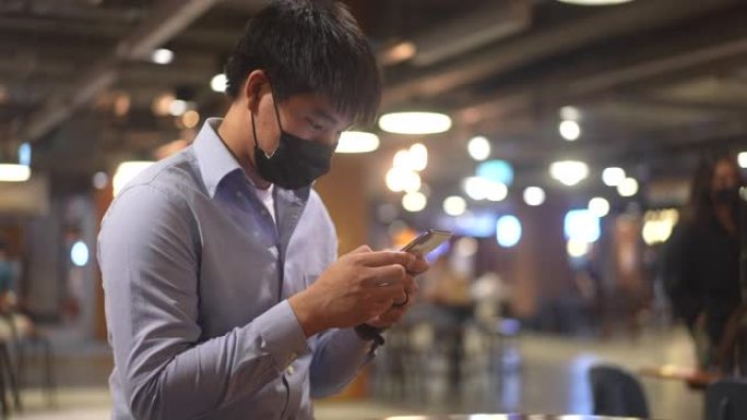 亚洲男子使用智能手机